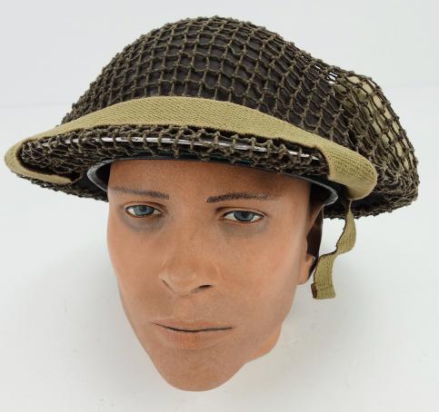 British Brodie Helmet with camo net and Bandage