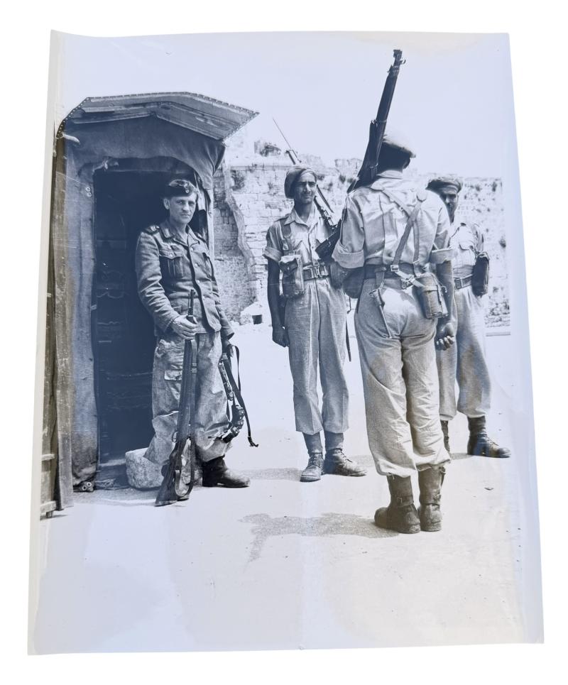 Very nice photograph of Kriegsmarine Costal Artillery Soldier holding guard with British Soldiers