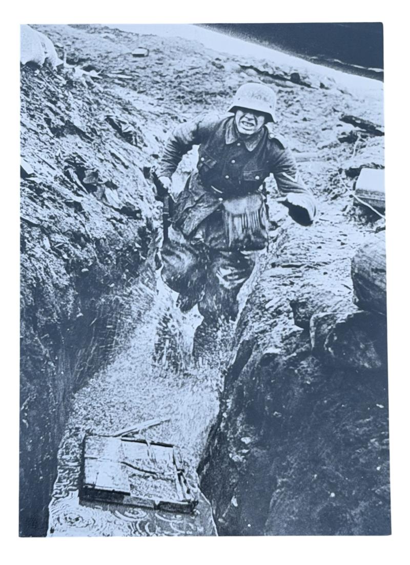 Very nice photograph of a Wehrmacht Soldier running in a Trench
