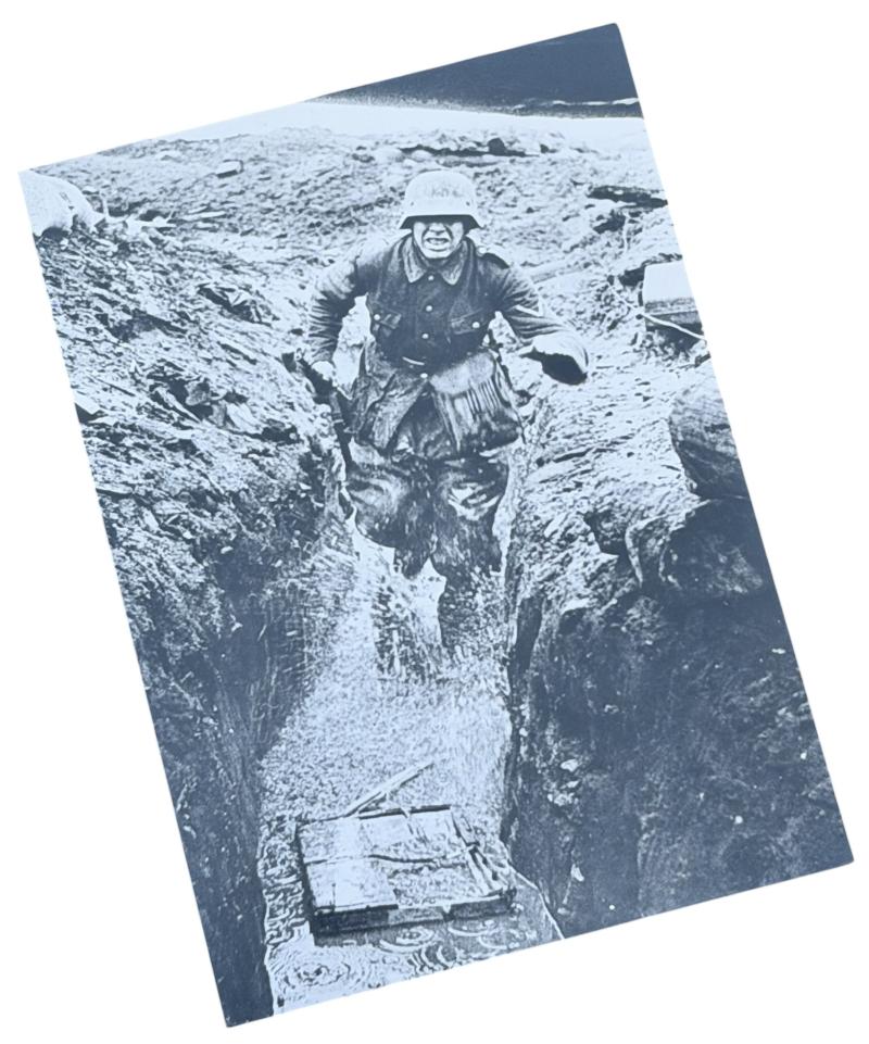 Very nice photograph of a Wehrmacht Soldier running in a Trench