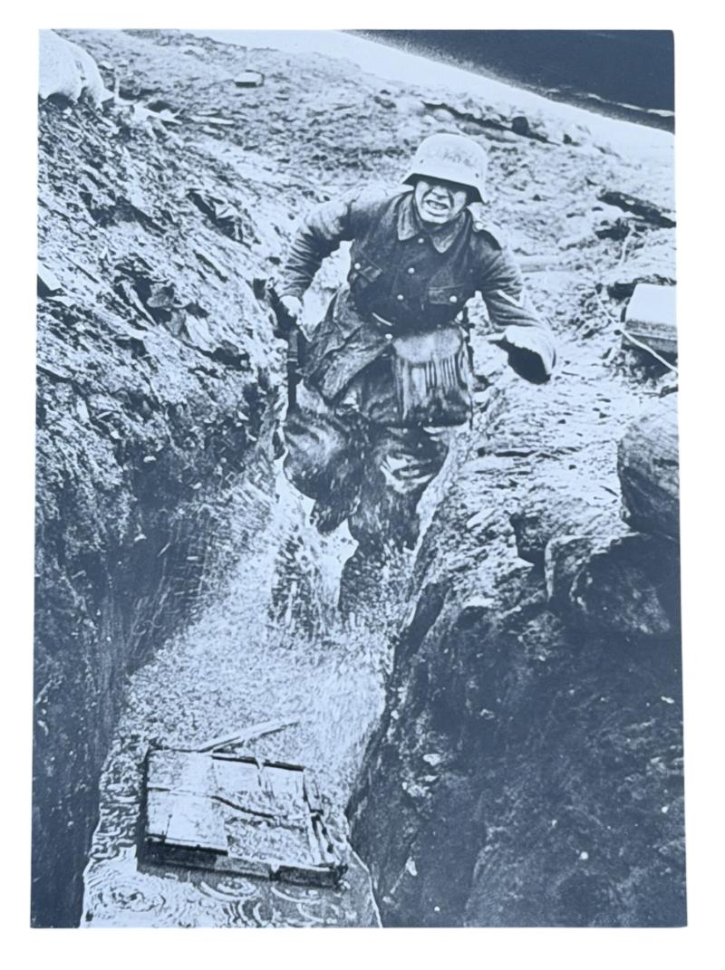 Very nice photograph of a Wehrmacht Soldier running in a Trench